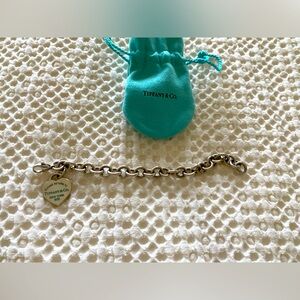 Tiffany’s chain bracelet with heart charm. Comes with Tiffany’s bag.